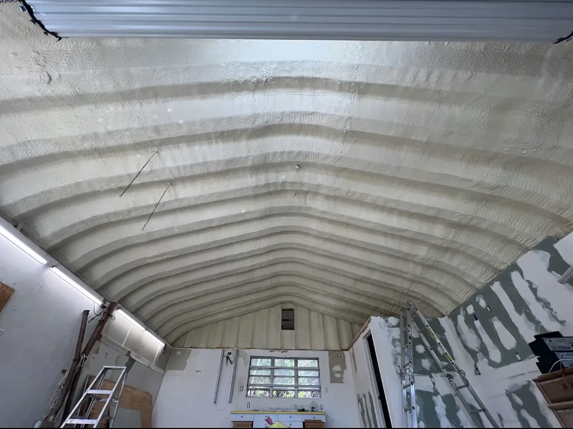 Spray polyurethane foam applied to the underside of a metal roof deck in Pleasanton